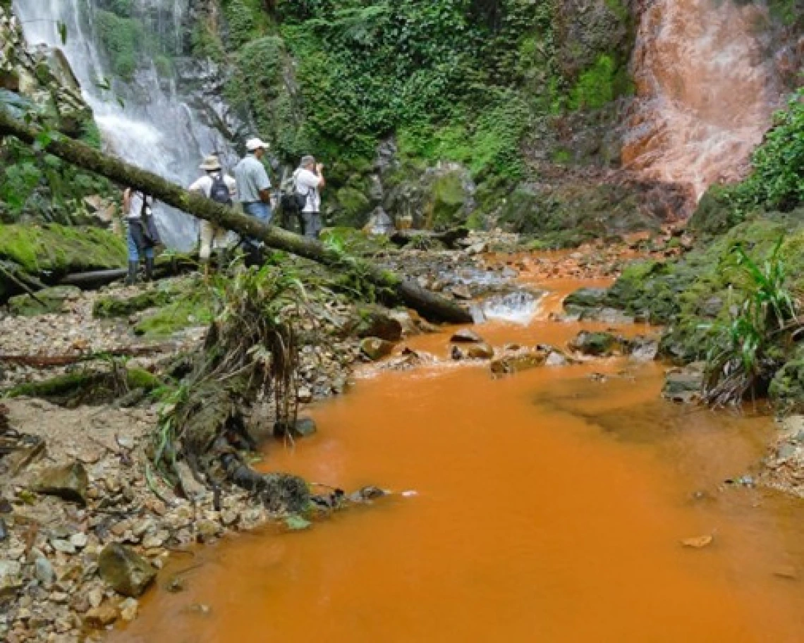Figure 4: “The twins” waterfalls in 2018. The test point labeled “GEM” is at the base of the waterfall at camera right.