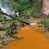 Figure 4: “The twins” waterfalls in 2018. The test point labeled “GEM” is at the base of the waterfall at camera right.